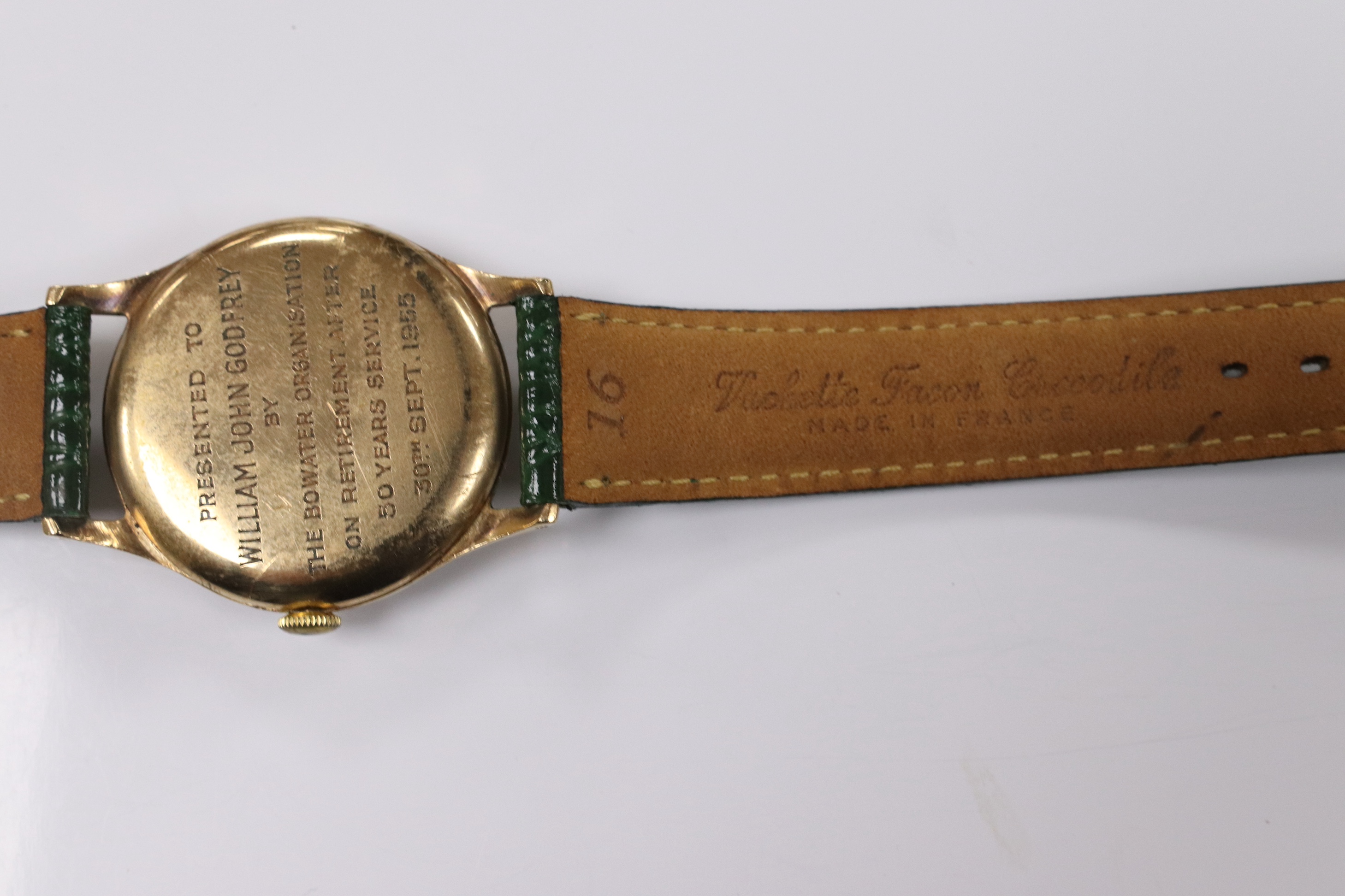 A gentleman's 1950's 9ct gold Movado manual wind wrist watch, with Arabic dial, subsidiary seconds and case back inscription, case diameter 31mm, on a later associated leather strap. Condition - fair